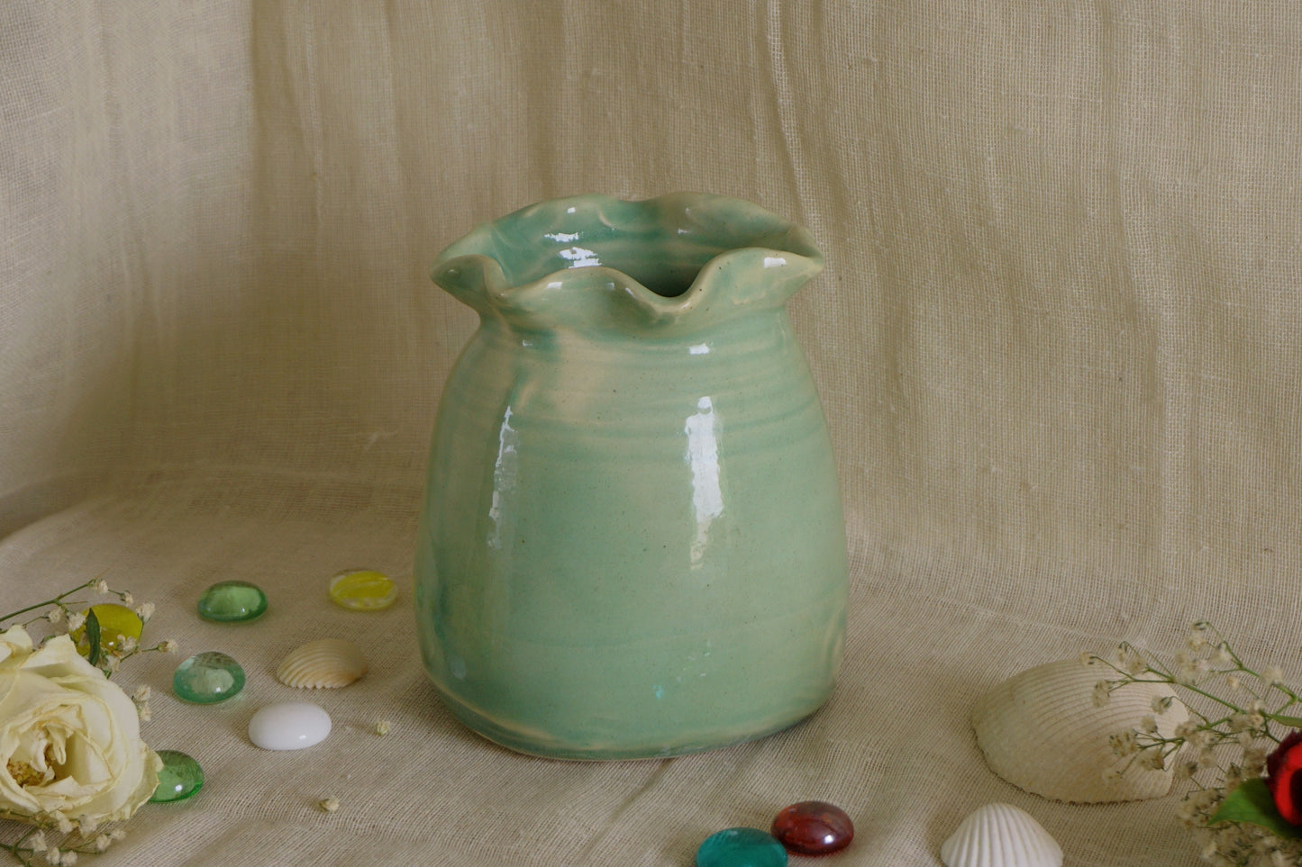 Celadon green vase with wavy rim
