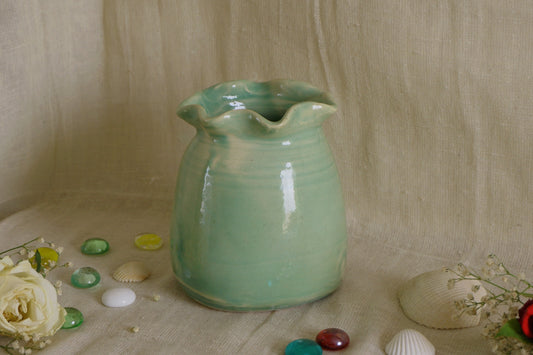Celadon green vase with wavy rim