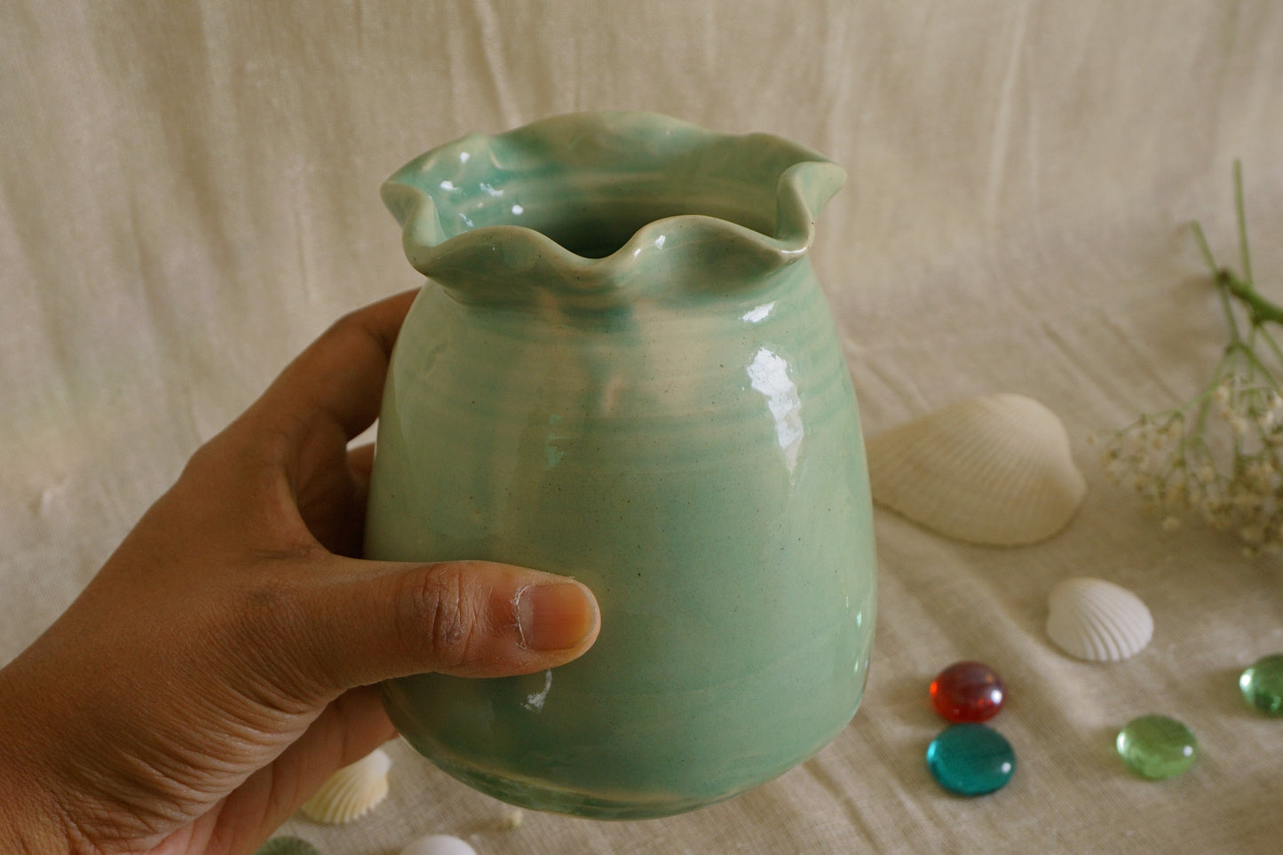 Celadon green vase with wavy rim