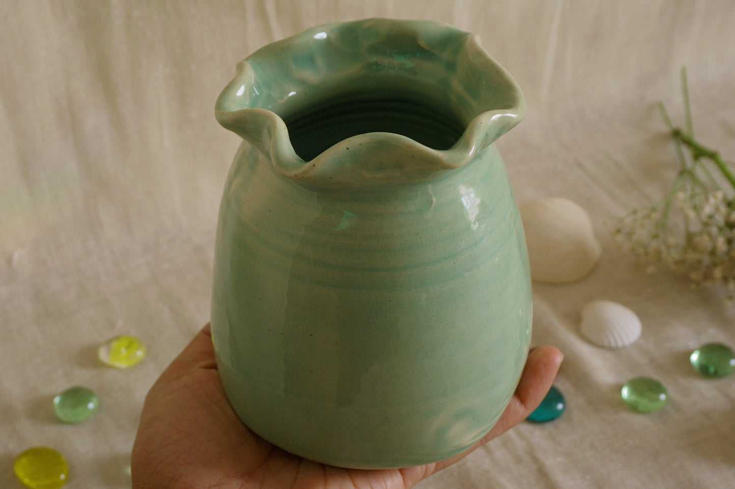 Celadon green vase with wavy rim