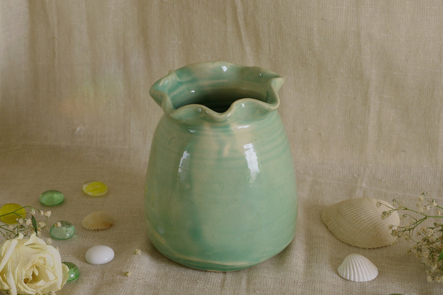 Celadon green vase with wavy rim