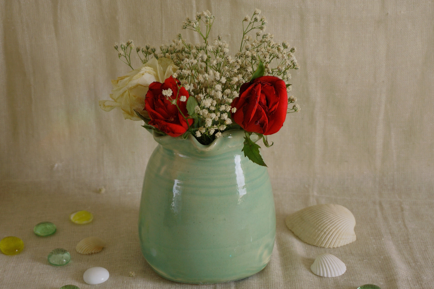 Celadon green vase with wavy rim