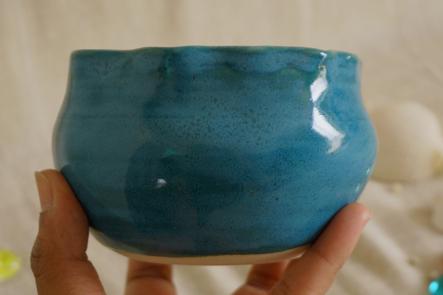 Teal blue bowl with a wavy rim