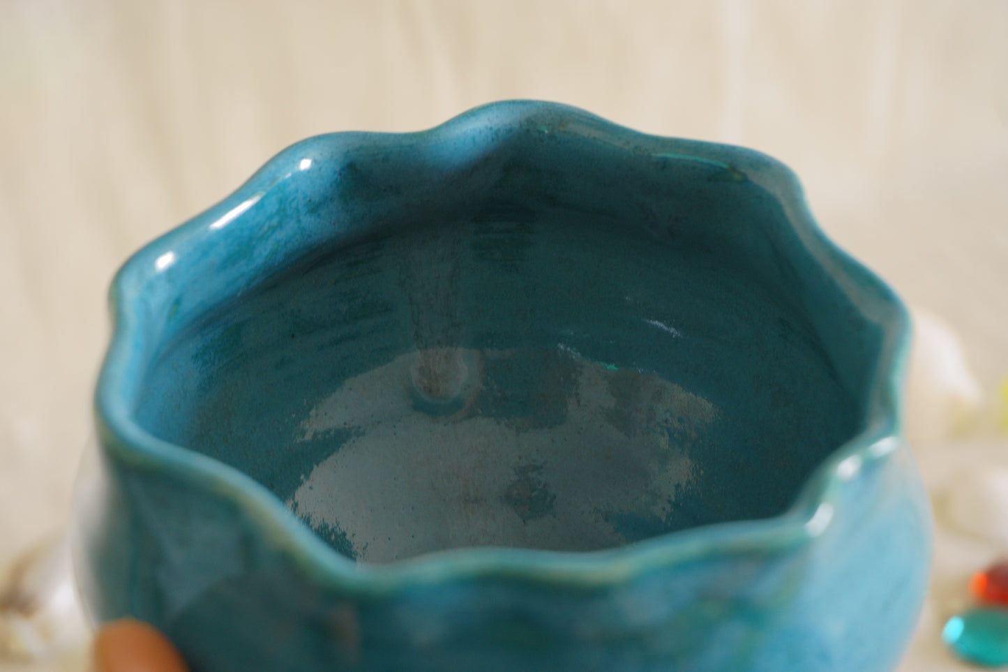 Teal blue bowl with a wavy rim