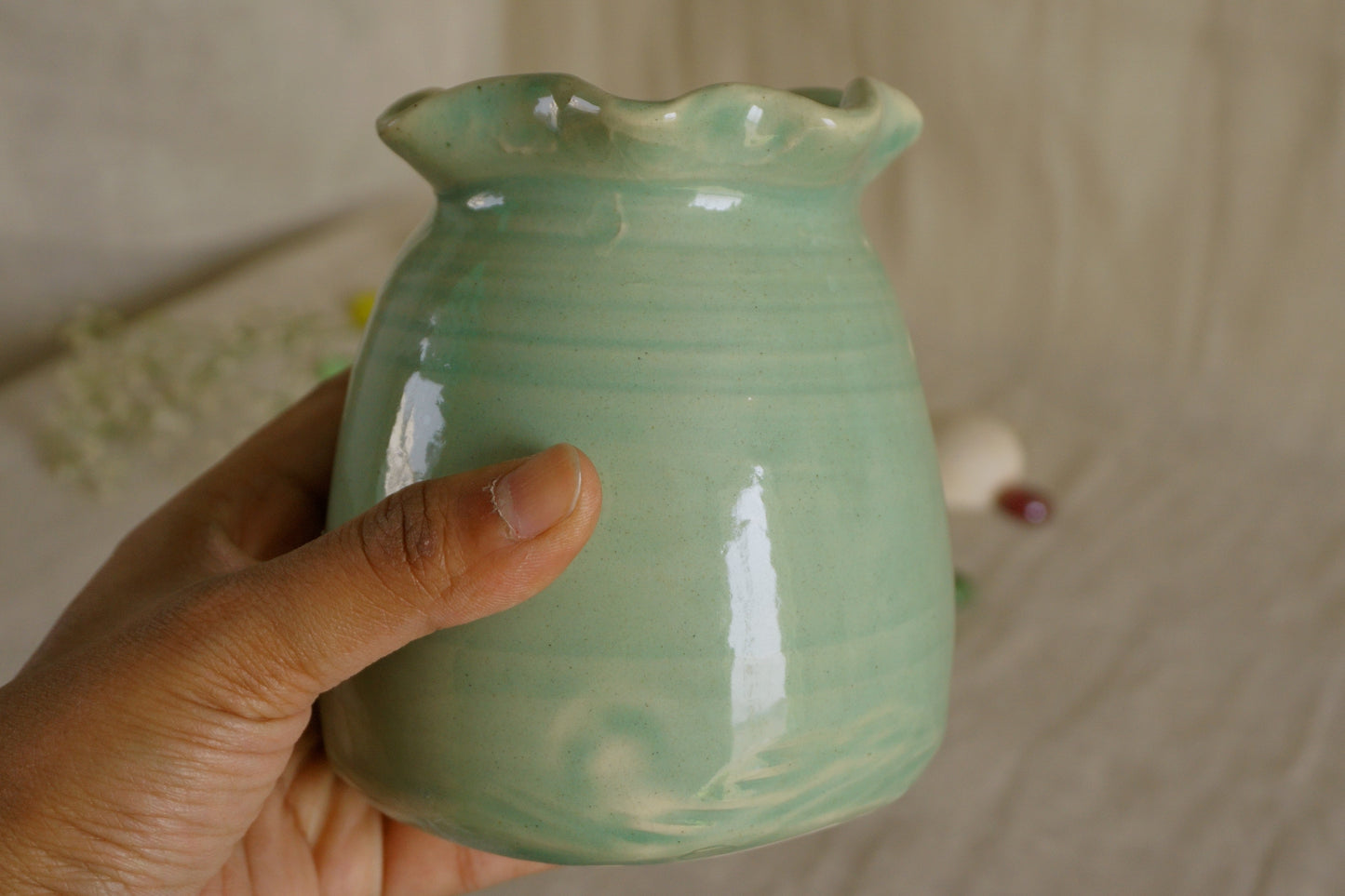 Celadon green vase with wavy rim